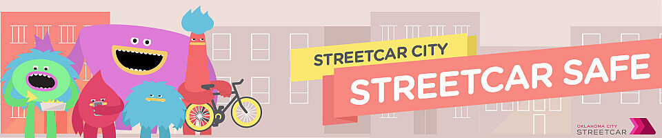 Banner with OKC Streetcar characters and text that reads "Streetcar City Streetcar Safe."