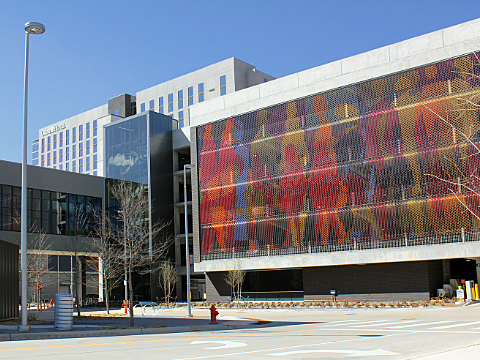 Outside of Convention Center Garage, showcasing the tile artwork on the south side of the building.
